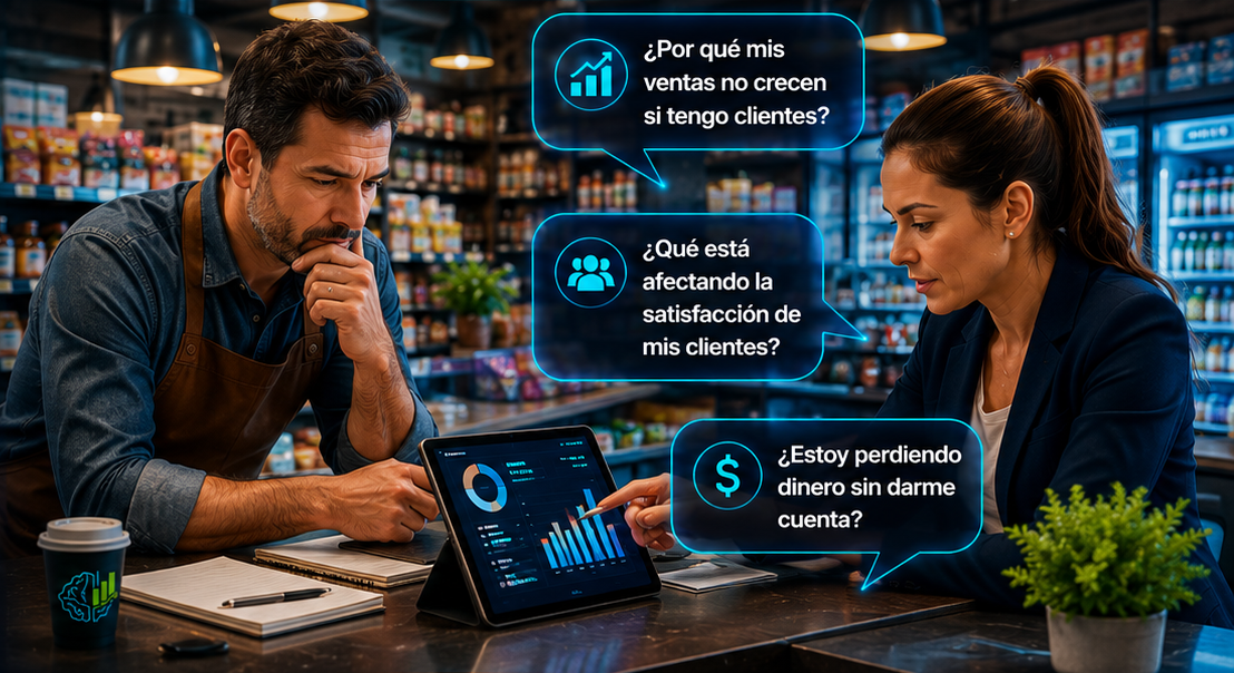 Consultora conversando con dueño de negocio mientras revisan indicadores en una tablet